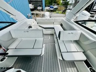 Slide: The Image of 2026 Sea Ray SDX 250 Outboard interior with sleek seating and modern design. - 11