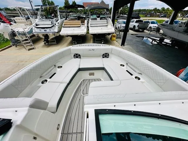 Slide: The Image of 2026 Sea Ray SDX 250 Outboard boat interior with spacious seating and modern design. - 15