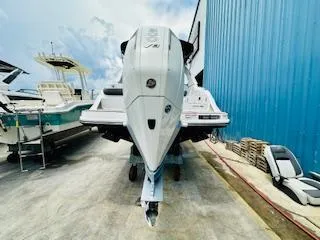 Slide: The Image of 2026 Sea Ray SDX 250 Outboard boat in a marina, front view. - 6