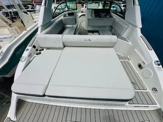 Slide: The Image of 2026 Sea Ray SDX 250 Outboard boat interior with spacious seating and modern design. - 7