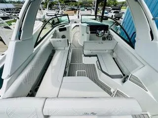 Slide: The Image of 2026 Sea Ray SDX 250 Outboard boat interior with sleek seating and modern design. - 9