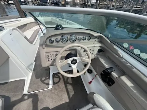 Slide: The Image of 1999 Cobalt 226 boat cockpit with steering wheel and instrument panel. - 12