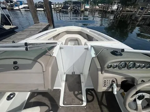 Slide: The Image of 1999 Cobalt 226 boat interior with dashboard and docked marina view. - 14
