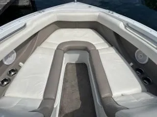 Slide: The Image of Interior of a 1999 Cobalt 226 boat with white and gray seating. - 18