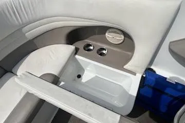 Slide: The Image of Interior of 1999 Cobalt 226 boat with cup holders and seating area. - 25