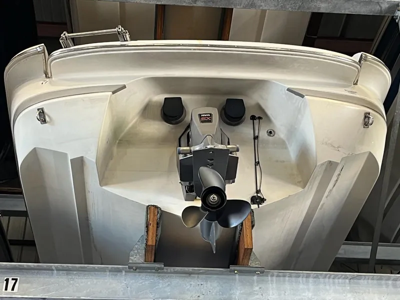 Slide: The Image of 1999 Cobalt 226 boat stern view with propeller in storage. - 27