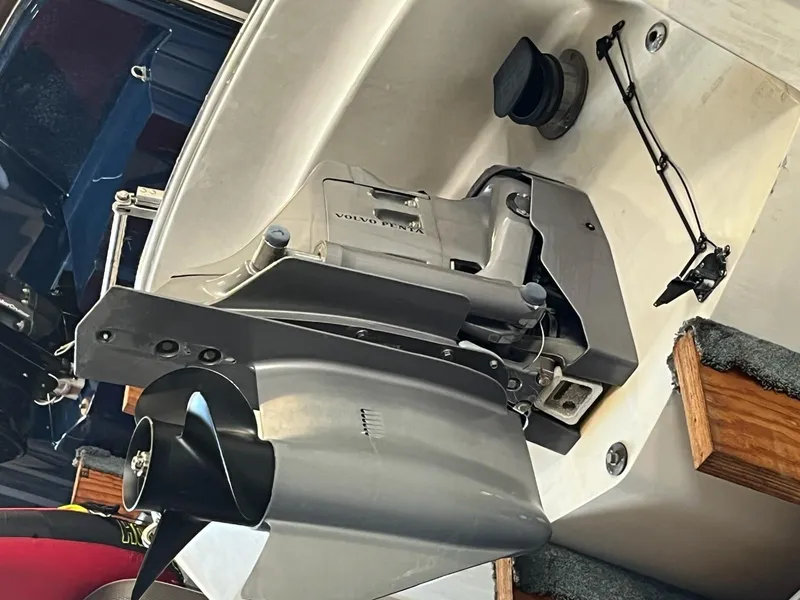 Slide: The Image of 1999 Cobalt 226 boat with Volvo Penta outdrive, detailed view of propeller and engine components. - 28
