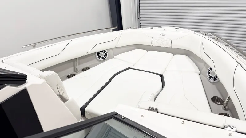 Slide: The Image of Luxurious interior of 2025 Regal LX4 boat with white seating and modern design. - 9