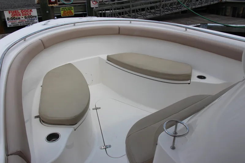Slide: The Image of 2016 Pursuit S 280 Sport boat interior with cushioned seating and cup holders. - 15