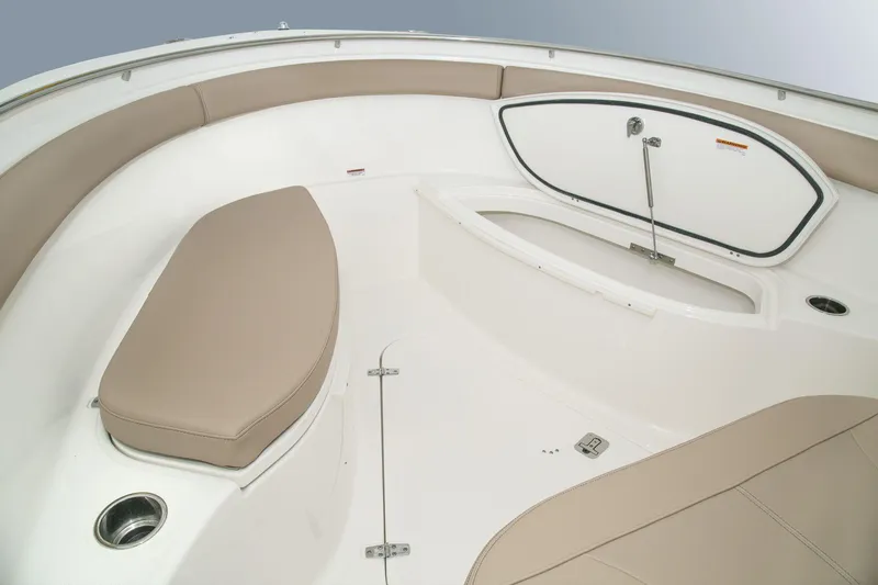 Slide: The Image of Manufacturer Provided Image: 2016 Pursuit S 280 Sport boat interior with beige seating and storage compartment. - 28