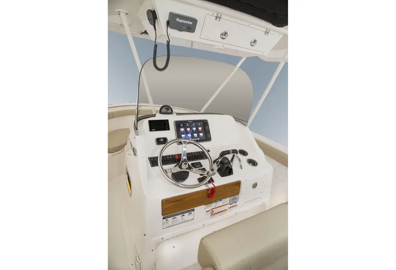 Slide: The Image of Manufacturer Provided Image: 2016 Pursuit S 280 Sport boat dashboard with steering wheel and navigation controls. - 30