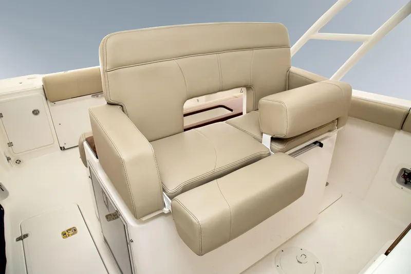 Slide: The Image of Manufacturer Provided Image: 2016 Pursuit S 280 Sport boat with beige cushioned seating. - 32