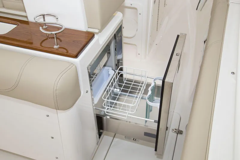 Slide: The Image of Manufacturer Provided Image: 2016 Pursuit S 280 Sport boat interior with pull-out storage drawer. - 33