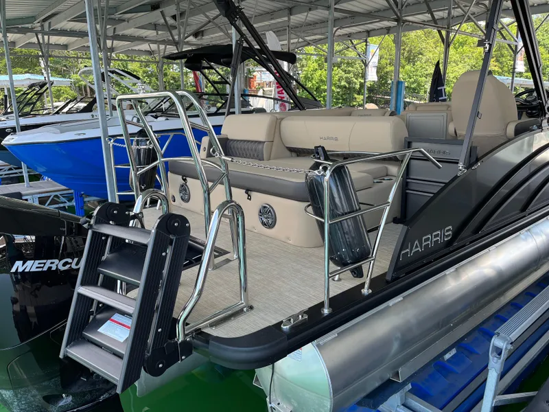 Slide: The Image of 2025 Harris Sunliner 230 pontoon boat with sleek design and comfortable seating. - 3
