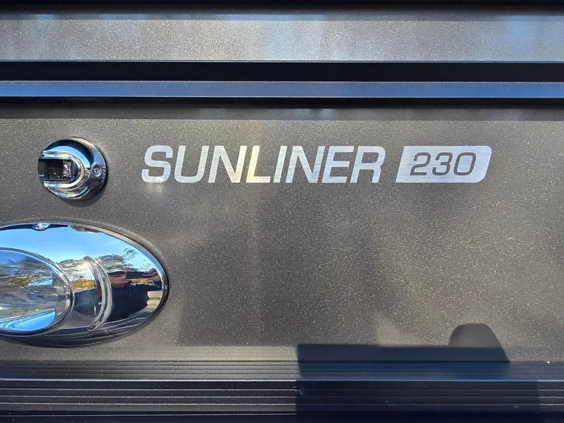 Slide: The Image of 2025 Harris Sunliner 230 logo on metallic surface with chrome accents. - 6