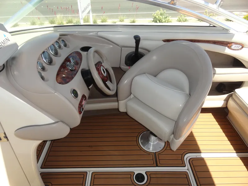 Slide: The Image of Interior of 2002 Sea Ray 220 Bow Rider with steering wheel and dashboard. - 11
