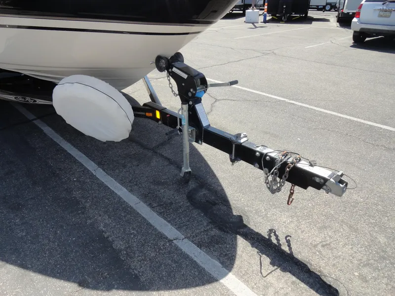 Slide: The Image of Trailer hitch of a 2002 Sea Ray 220 Bow Rider in a parking lot. - 19