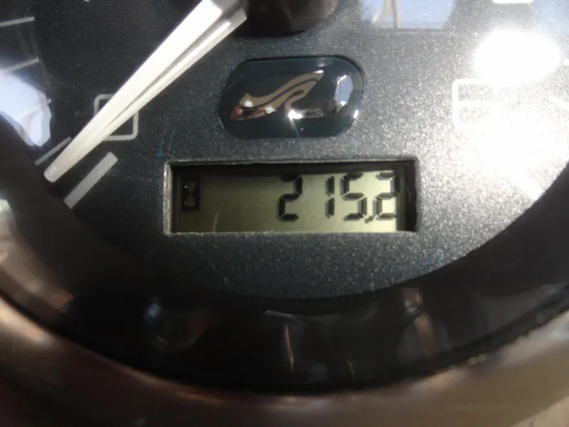 Slide: The Image of Close-up of a 2002 Sea Ray 220 Bow Rider boat gauge displaying 215.2 hours. - 9
