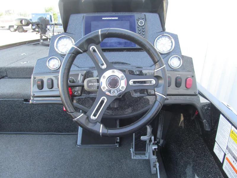 Slide: The Image of Steering wheel and dashboard of 2021 Nitro Z18 Pro boat with control panel and gauges. - 7