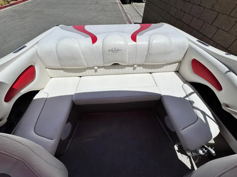 Slide: The Image of 2006 Stingray 195 LR boat interior with white and red seating. - 12