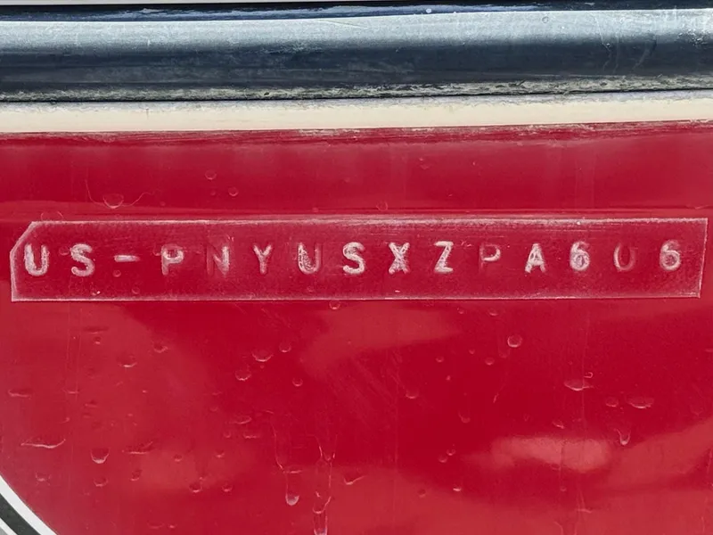 Slide: The Image of VIN on red 2006 Stingray 195 LR boat hull. - 21