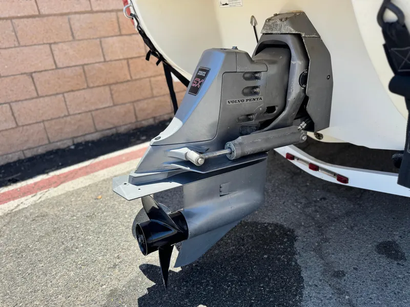 Slide: The Image of 2006 Stingray 195 LR boat with Volvo Penta outdrive, parked on pavement. - 7