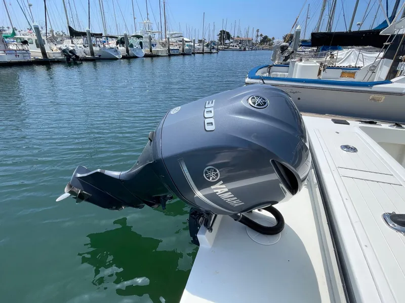 Slide: The Image of Yamaha 300 outboard motor on a 2016 Parker 2530 Extended Sport Cabin boat at marina. - 11