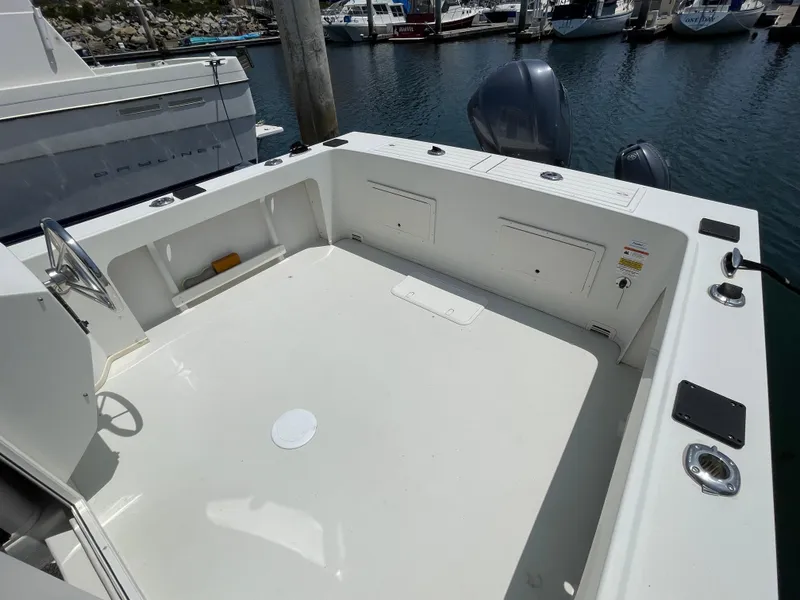 Slide: The Image of 2016 Parker 2530 Extended Sport Cabin boat deck at marina. - 15