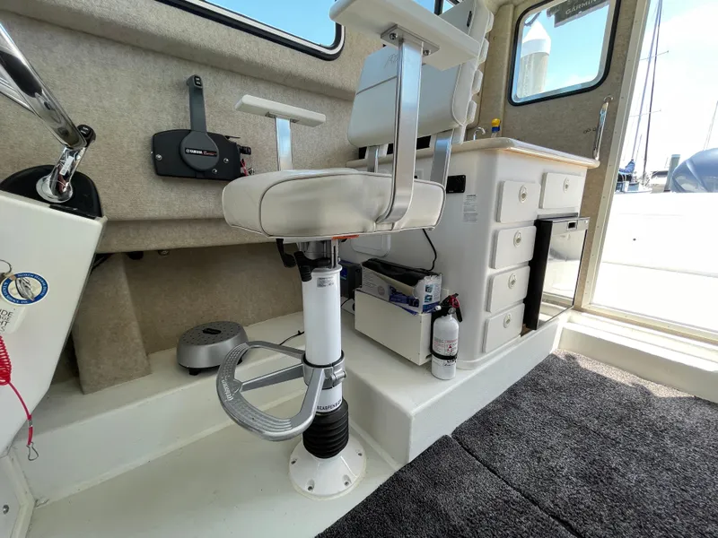 Slide: The Image of Interior of 2016 Parker 2530 Extended Sport Cabin with seating and storage. - 27