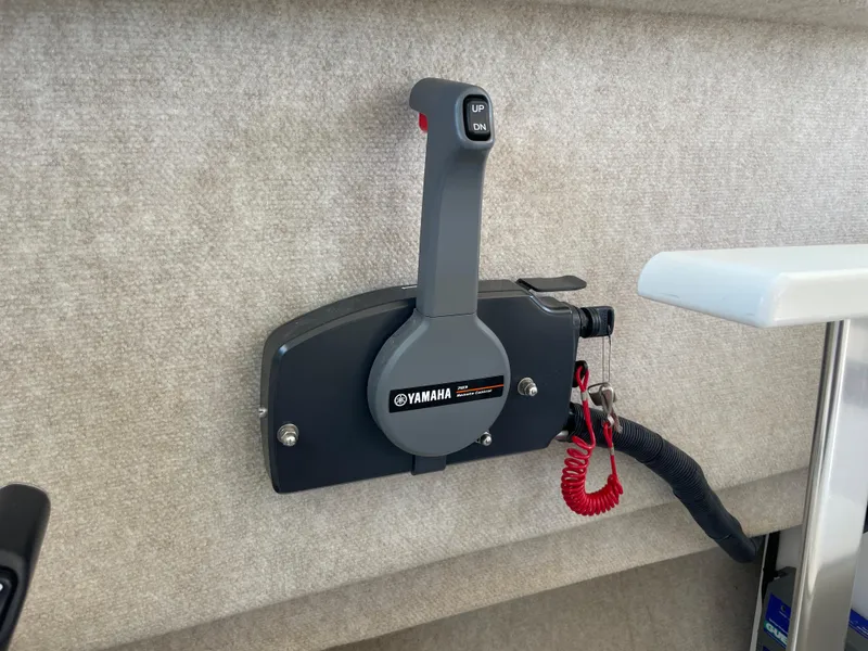 Slide: The Image of Yamaha throttle control on 2016 Parker 2530 Extended Sport Cabin boat interior. - 28