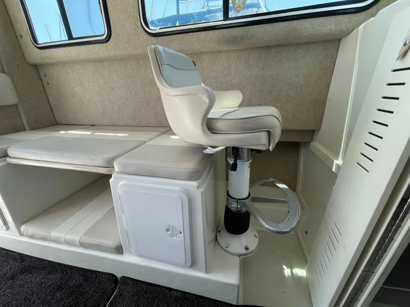 Slide: The Image of Interior of 2016 Parker 2530 Extended Sport Cabin with seating and storage. - 32