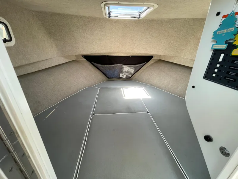 Slide: The Image of 2016 Parker 2530 Extended Sport Cabin interior with gray upholstery and overhead hatch. - 35
