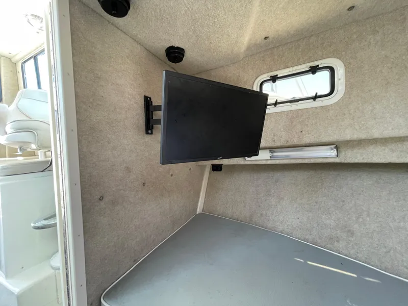 Slide: The Image of Interior of 2016 Parker 2530 Extended Sport Cabin with mounted TV and window. - 39