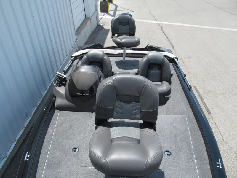 Slide: The Image of 2019 Tracker Pro Team 175 TXW boat interior with gray seating and carpeted floor. - 10