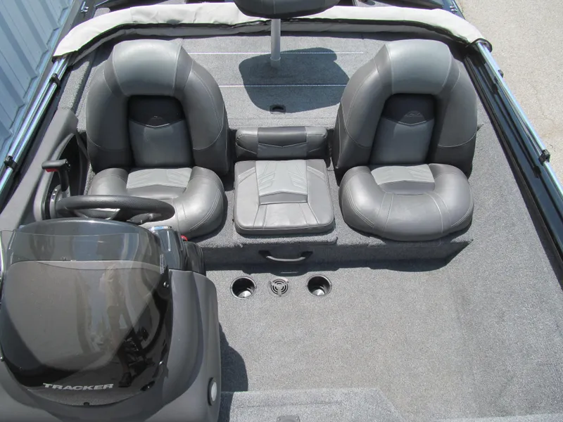 Slide: The Image of 2019 Tracker Pro Team 175 TXW boat interior with gray seating and steering console. - 11