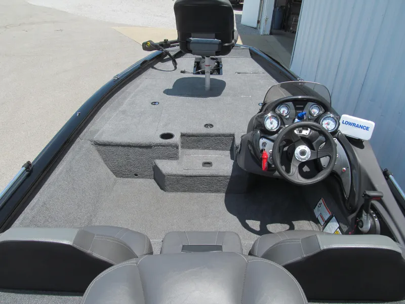Slide: The Image of 2019 Tracker Pro Team 175 TXW boat interior with steering console and seating. - 5
