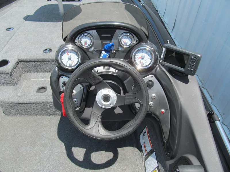 Slide: The Image of 2019 Tracker Pro Team 175 TXW boat dashboard with steering wheel and gauges. - 6
