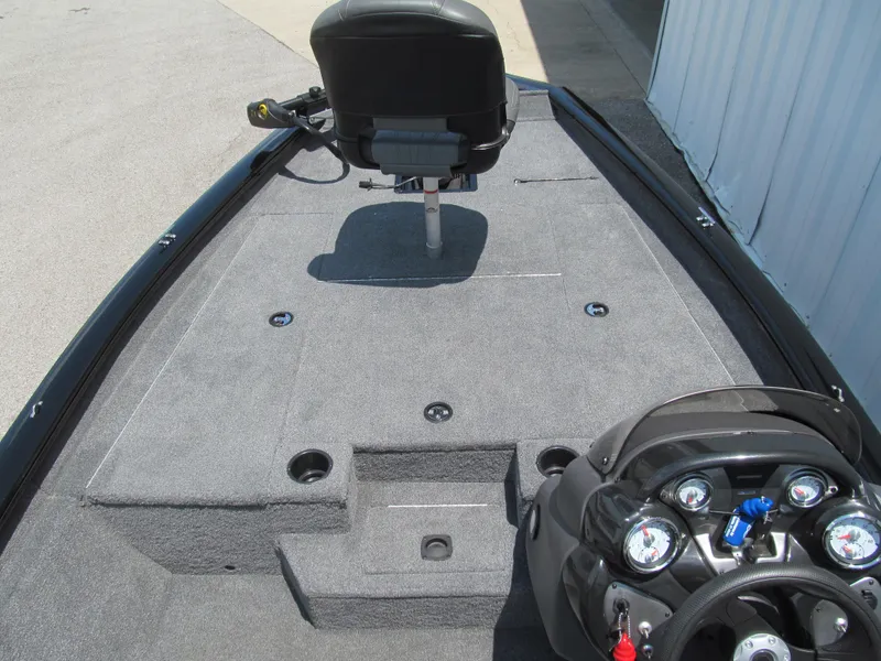 Slide: The Image of 2019 Tracker Pro Team 175 TXW boat interior with steering console and seating. - 7