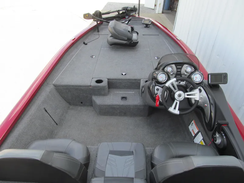 Slide: The Image of 2019 Tracker Pro Team 190 TX Tournament Edition boat interior with steering console and seating. - 4