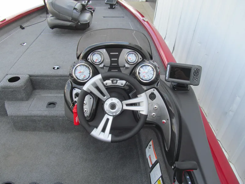 Slide: The Image of 2019 Tracker Pro Team 190 TX Tournament Edition boat dashboard with steering wheel and gauges. - 5