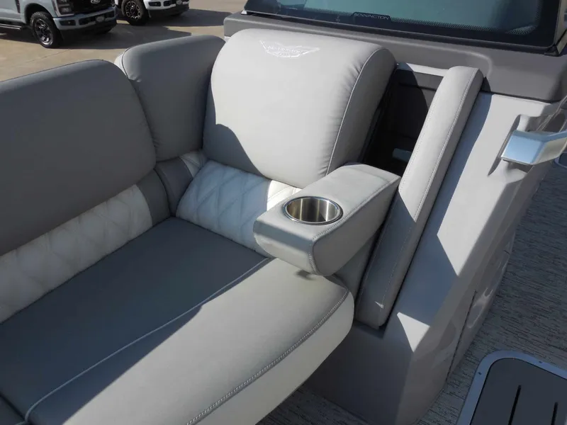 Slide: The Image of Gray upholstery with quilted details and a built-in cup holder on a boat seat. - 16