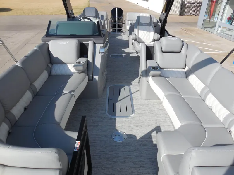 Slide: The Image of The image shows the interior of a 2025 Bennington 25 QFBA with gray upholstered seating. - 15