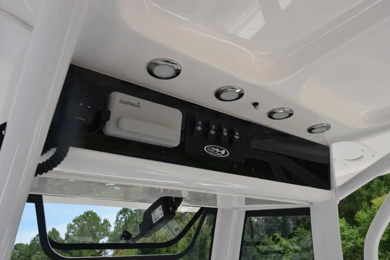 Slide: The Image of 2021 Sea Hunt Ultra 255 SE boat console with Garmin electronics and control panel. - 11