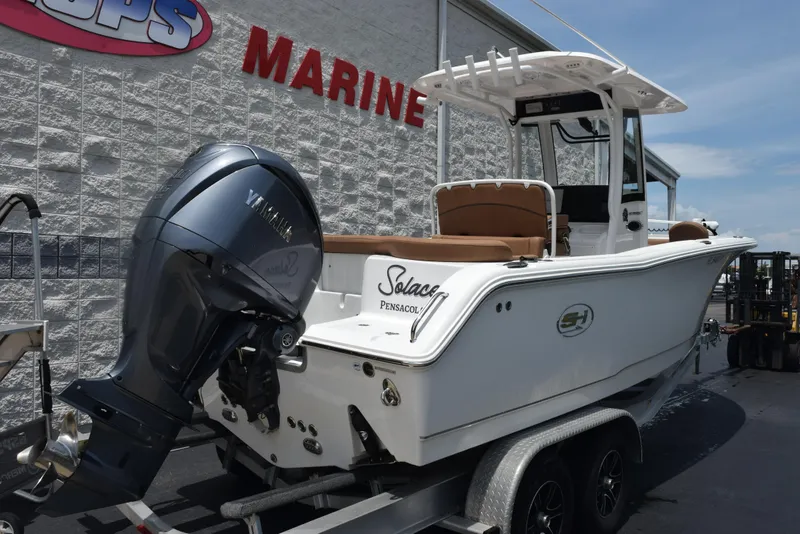 Slide: The Image of 2021 Sea Hunt Ultra 255 SE boat with Yamaha engine on trailer at marine shop. - 4