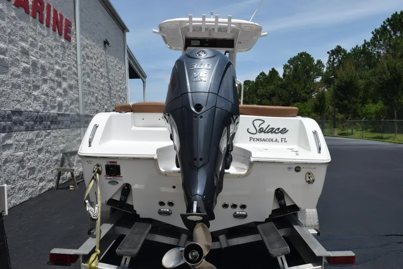 Slide: The Image of 2021 Sea Hunt Ultra 255 SE boat with powerful outboard motor, parked on trailer. - 5