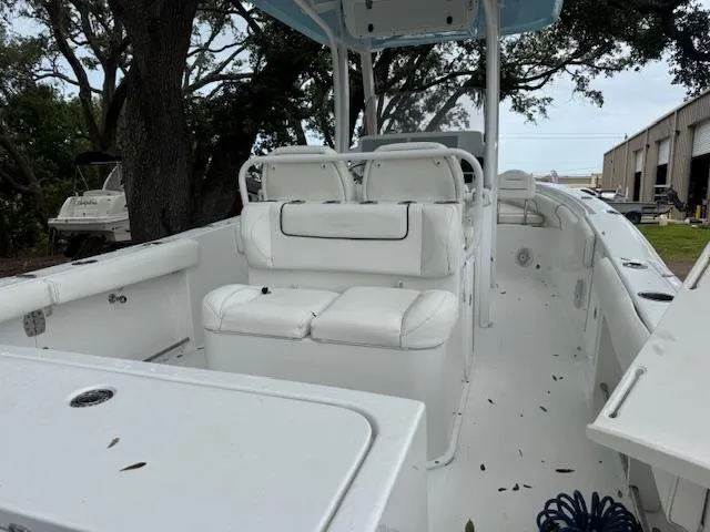 Slide: The Image of 2016 Sea Hunt Gamefish 27 boat with white seating and spacious deck. - 10
