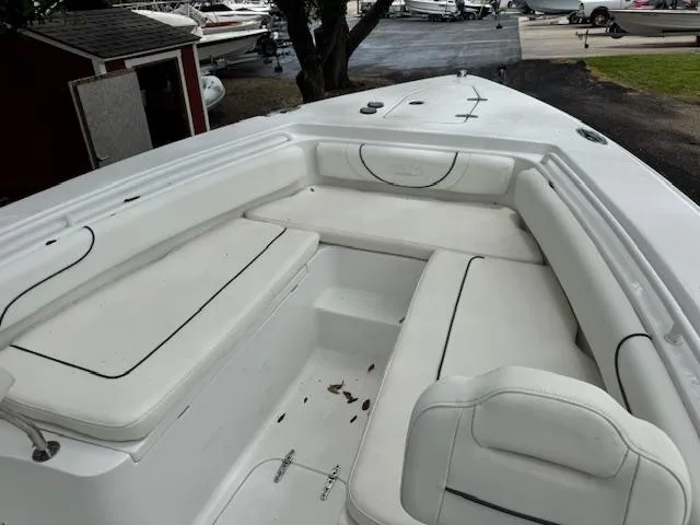 Slide: The Image of 2016 Sea Hunt Gamefish 27 boat with spacious white seating area. - 12