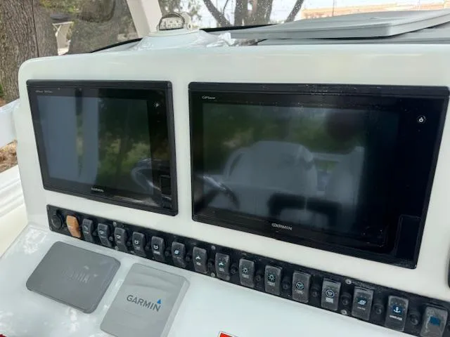 Slide: The Image of Control panel of a 2016 Sea Hunt Gamefish 27 with dual Garmin displays. - 13