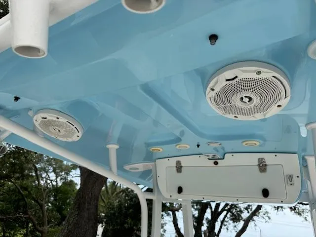 Slide: The Image of 2016 Sea Hunt Gamefish 27 boat speakers and storage on blue ceiling. - 15