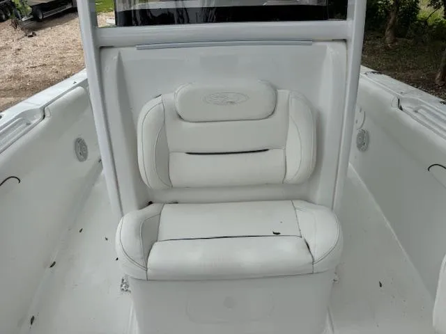 Slide: The Image of 2016 Sea Hunt Gamefish 27 boat with white cushioned seating. - 16